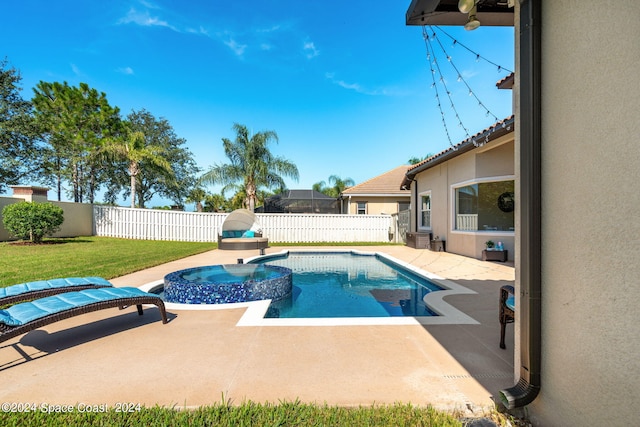 view of swimming pool with a patio and a yard