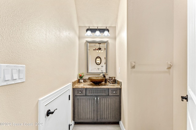 bathroom featuring vanity and a textured ceiling