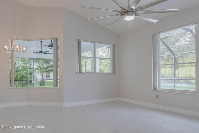 unfurnished room with ceiling fan with notable chandelier and vaulted ceiling