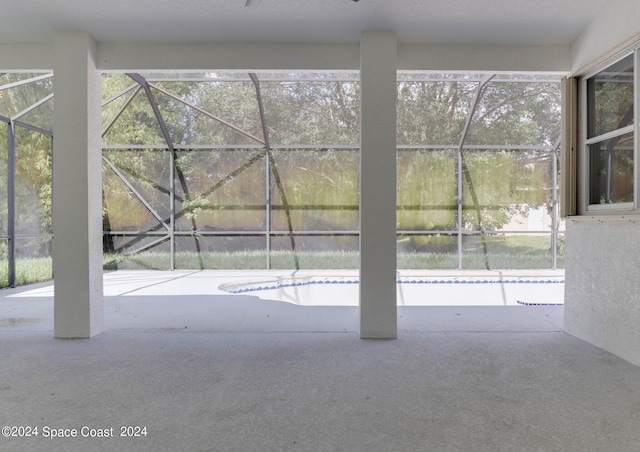 exterior space with a lanai and a patio area