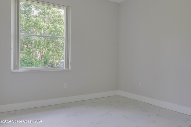 spare room featuring plenty of natural light