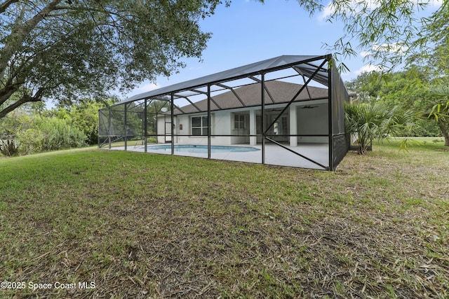 3520 Shady Run Rd, Melbourne, FL 32934 - rear view of property with a yard, an outdoor pool, a lanai, and a patio area