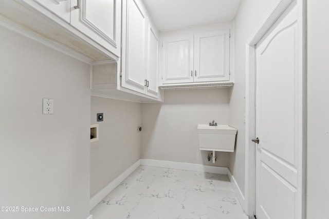 3520 Shady Run Rd, Melbourne, FL 32934 - laundry room with cabinet space, hookup for an electric dryer, light marble finish floors, and baseboards