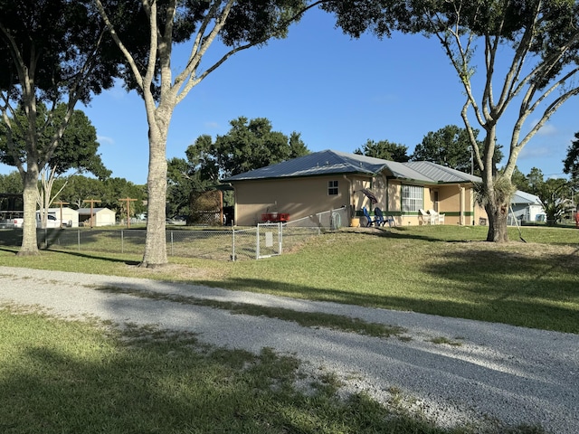 view of side of home featuring a yard