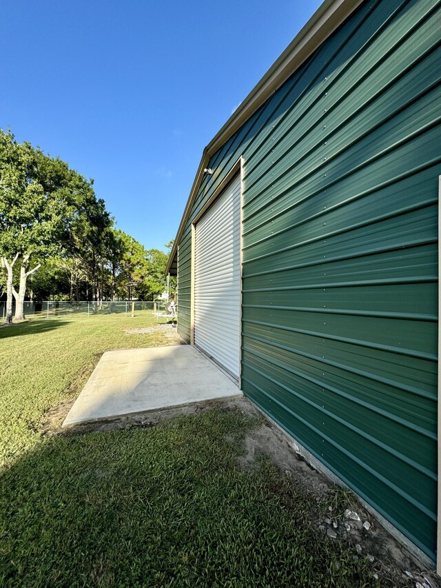 garage with a lawn