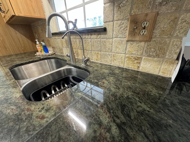 details with sink and decorative backsplash