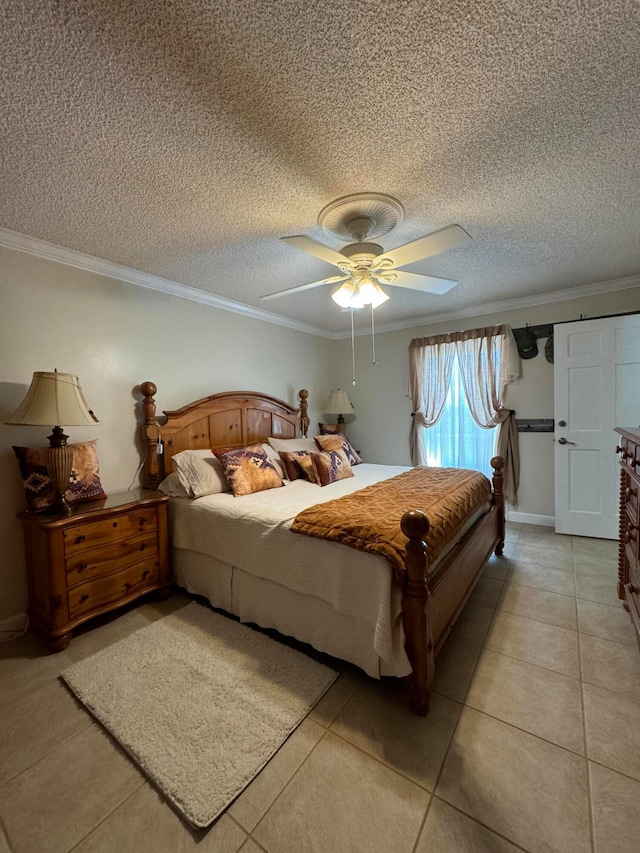 bedroom with ceiling fan, crown molding, light tile patterned flooring, and a textured ceiling