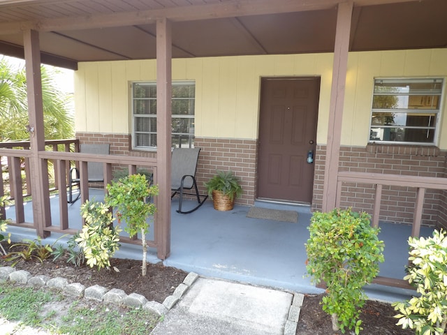 entrance to property with covered porch