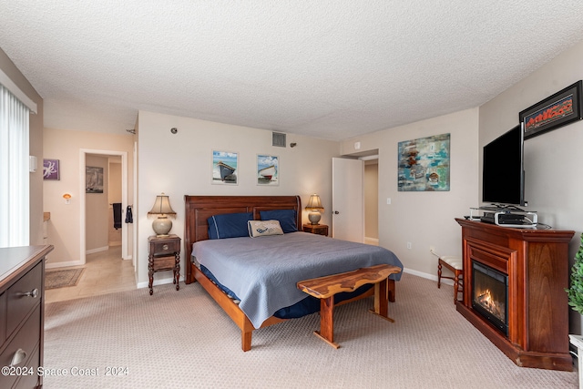 carpeted bedroom with a textured ceiling