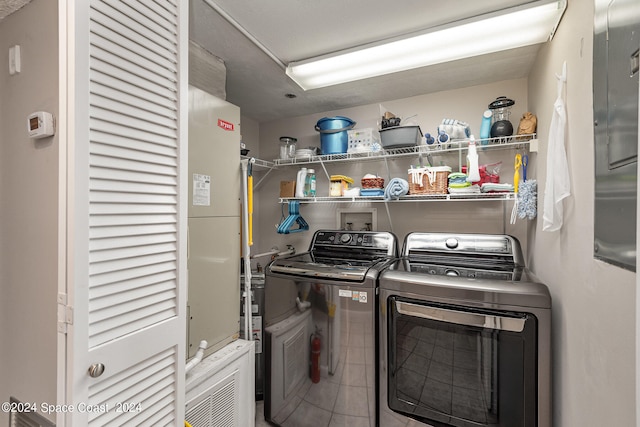 laundry room with separate washer and dryer