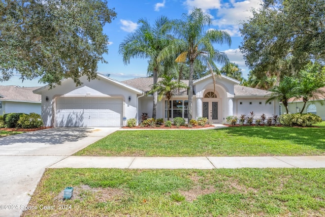 ranch-style house with a front lawn and a garage