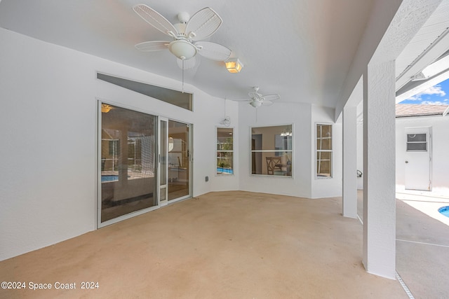 interior space featuring ceiling fan and light colored carpet