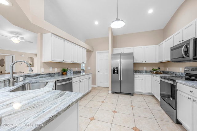 kitchen with ceiling fan, white cabinetry, light tile patterned floors, stainless steel appliances, and sink