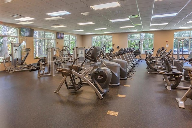 gym featuring a paneled ceiling