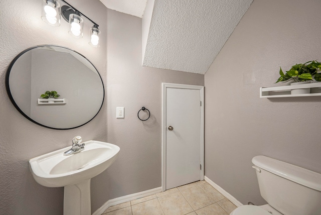 bathroom featuring tile patterned floors and toilet