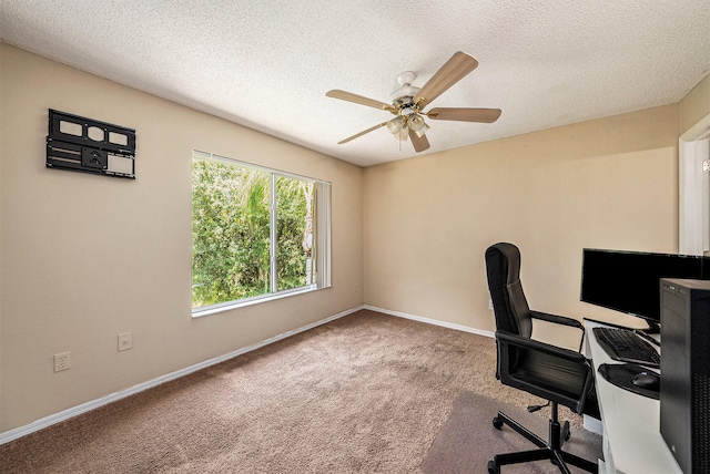 carpeted office space with ceiling fan and a textured ceiling