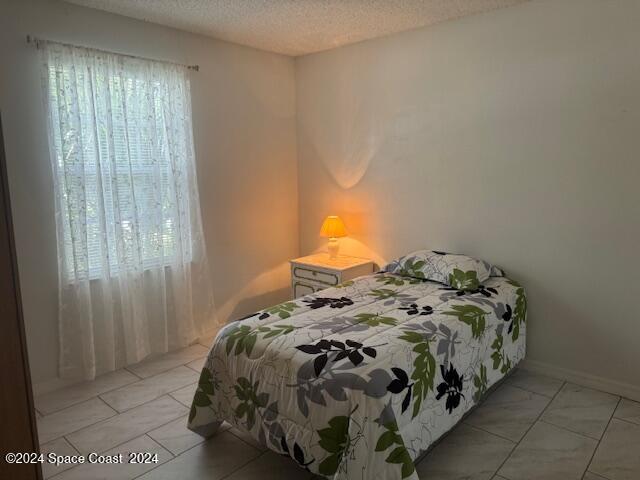 bedroom featuring a textured ceiling