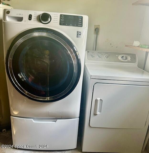 laundry area featuring separate washer and dryer