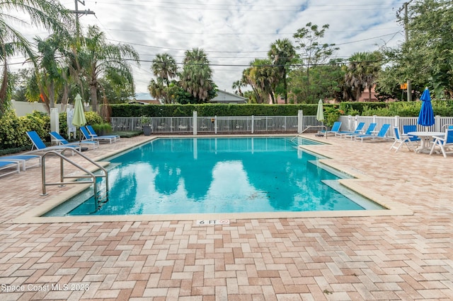 view of pool featuring a patio