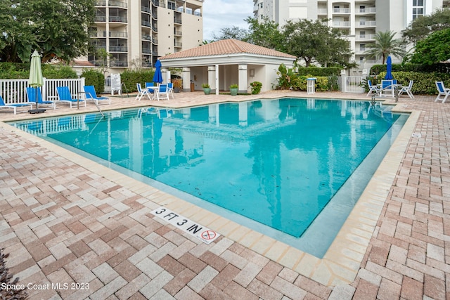 view of swimming pool featuring a patio