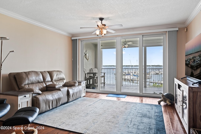 living room featuring ornamental molding and hardwood / wood-style floors