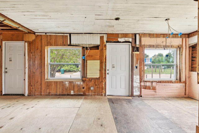 interior space featuring wood walls