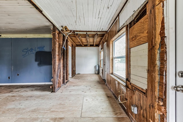 corridor with wood ceiling and wooden walls