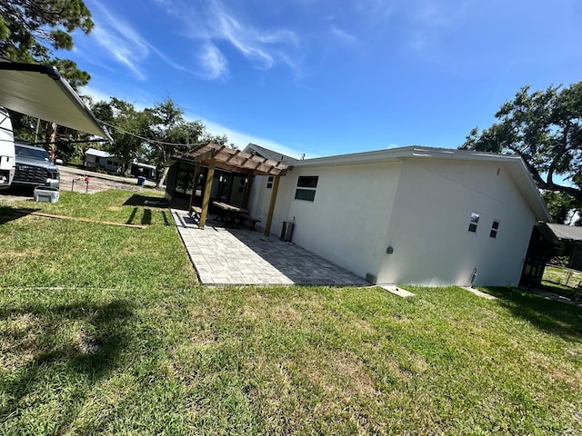 view of yard with a pergola and a patio area