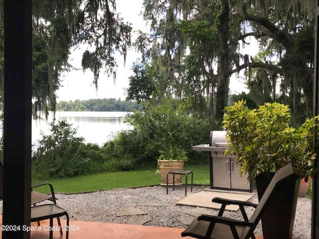 view of patio / terrace with a water view