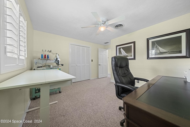 carpeted office with ceiling fan