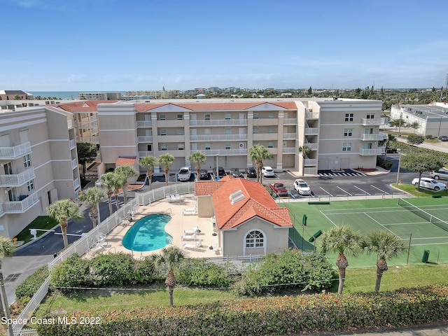 view of building exterior with a community pool