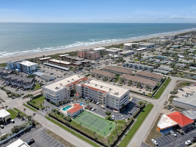 bird's eye view with a water view and a view of the beach