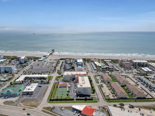 birds eye view of property featuring a beach view and a water view