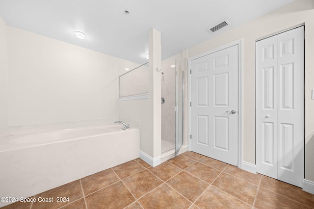 full bathroom with visible vents, a garden tub, tile patterned flooring, a shower stall, and a closet