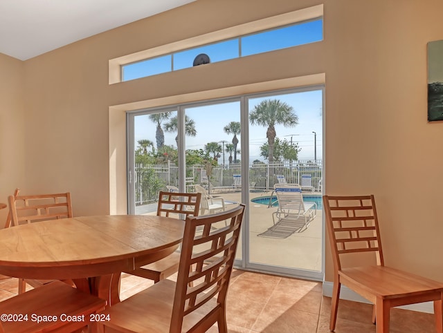 dining area with light tile patterned flooring and a wealth of natural light