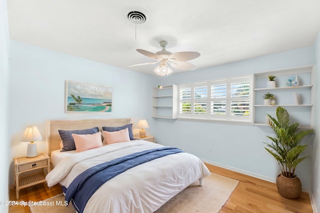 bedroom featuring light wood-type flooring and ceiling fan