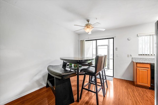 dining room featuring ceiling fan, plenty of natural light, and light hardwood / wood-style floors