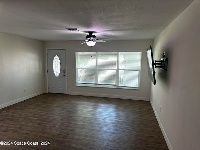 entrance foyer with a textured ceiling, ceiling fan, and hardwood / wood-style floors