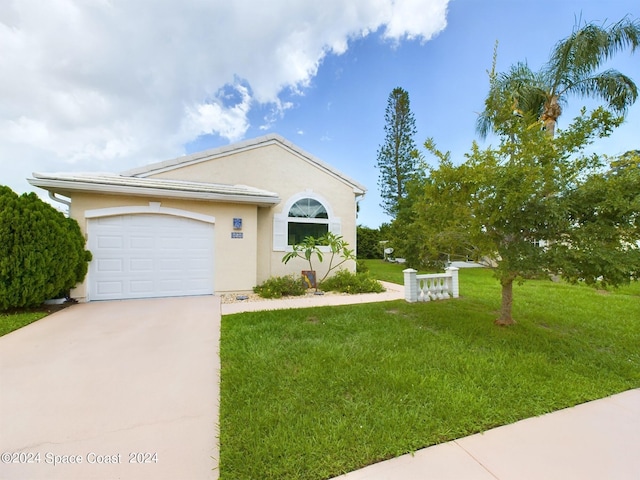 ranch-style home with a front lawn and a garage