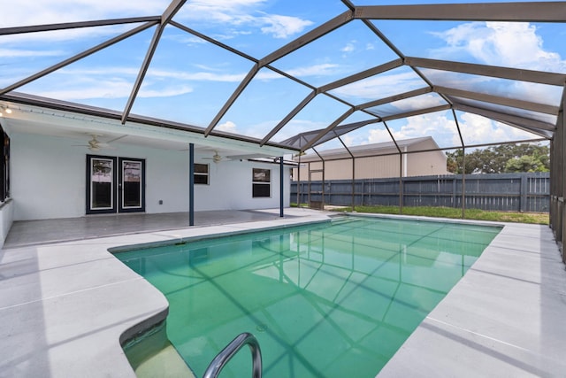 view of pool featuring ceiling fan, a lanai, and a patio