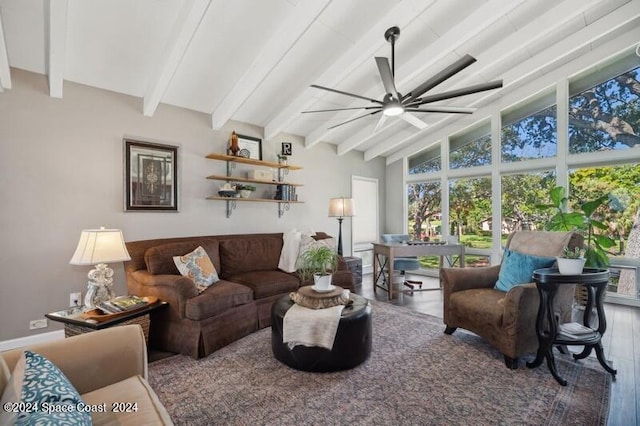 living room with lofted ceiling with beams, ceiling fan, and wood-type flooring