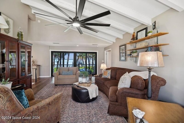 living room with ceiling fan, lofted ceiling with beams, and dark hardwood / wood-style floors