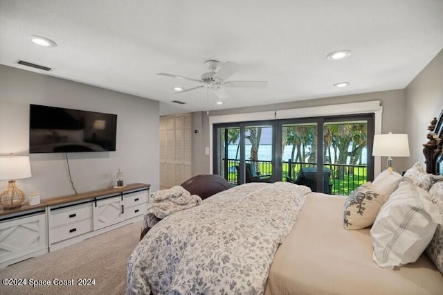 bedroom with access to exterior, ceiling fan, a closet, and carpet