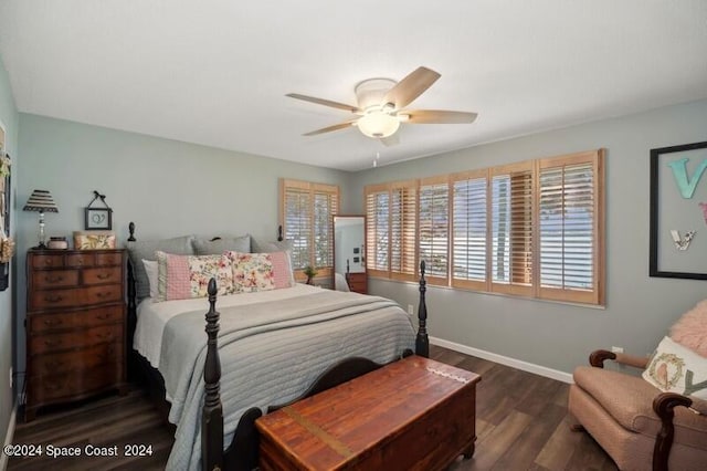 bedroom with ceiling fan and dark hardwood / wood-style flooring