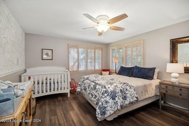 bedroom featuring ceiling fan and dark hardwood / wood-style floors