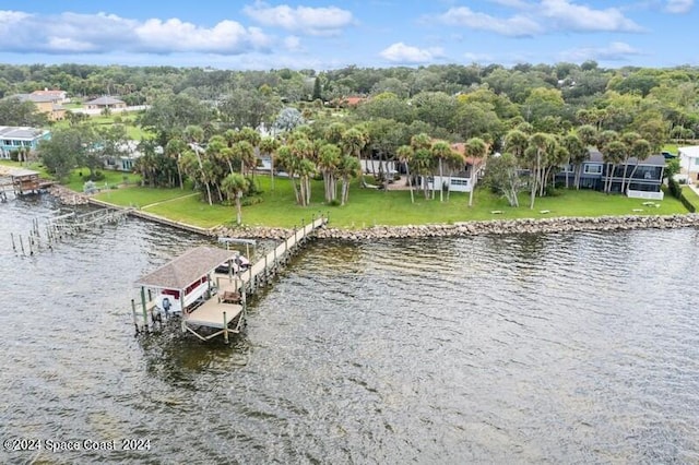 exterior space featuring a water view and a yard