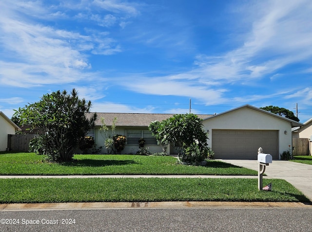 ranch-style house with a front lawn and a garage