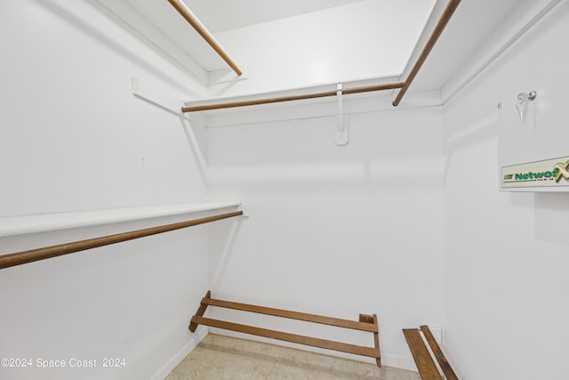 walk in closet featuring light tile patterned floors