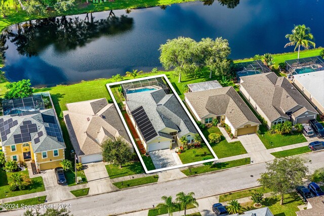 birds eye view of property with a water view