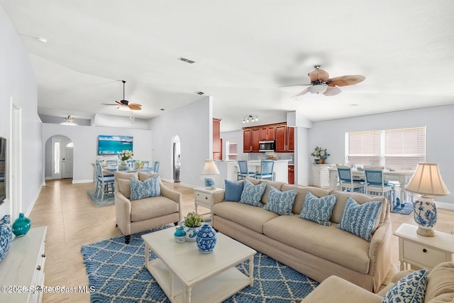 living room with ceiling fan